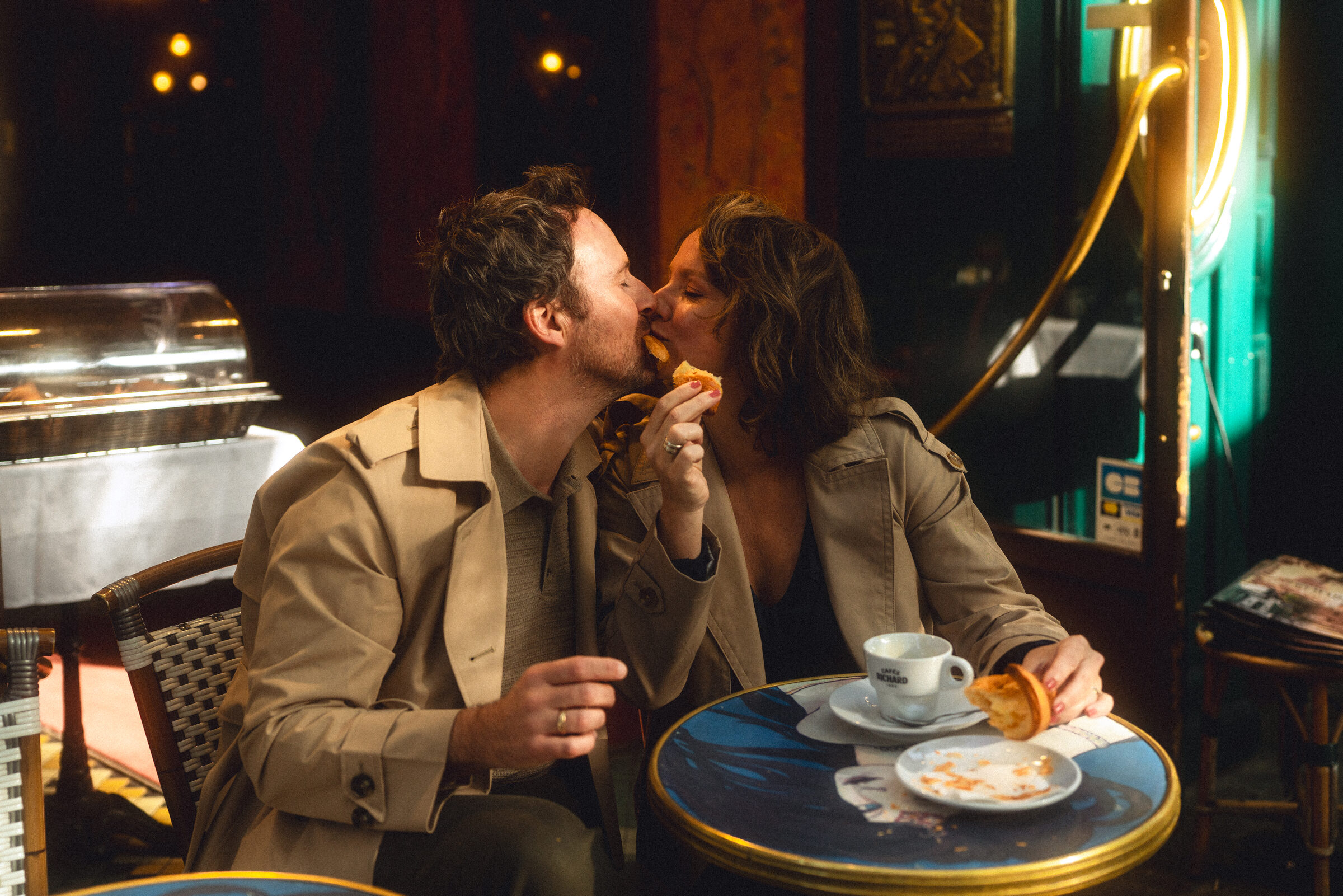 Shilah and Guillaume sharing a croissant in Paris