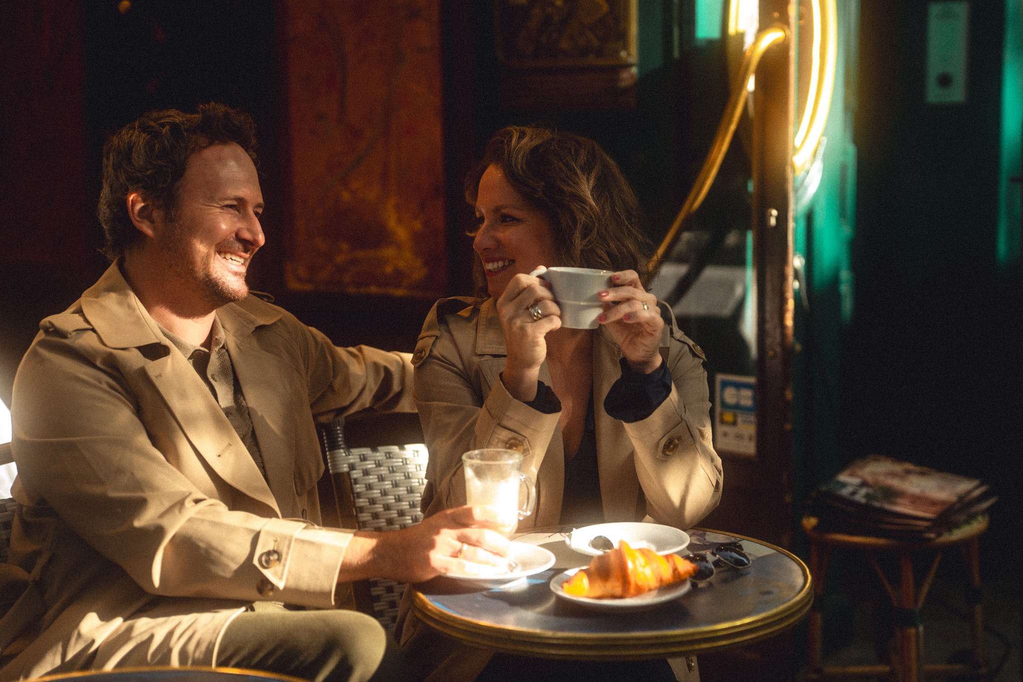 Shilah and Guillaume sharing coffee and croissants in Paris